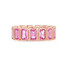 Design This eternity band features vertically set emerald cut pink sapphires in a handmade bezel mounting. Details & Dimensions - 0.25 carats each stone- 3.75 carat total weight (based on Size 6) Pink Sapphire Rose Gold Ring, Pink Sapphire Ring Rose Gold, Bezel Eternity Band, Sapphire Rose Gold Ring, Diamond Evil Eye, Pink Stuff, Solitaire Necklaces, Domed Ring, Tennis Bracelet Diamond