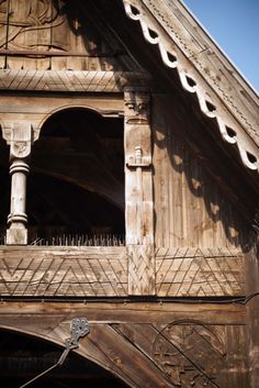 an old wooden building with ornate carvings on it