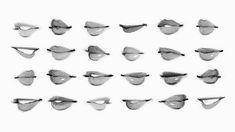 a group of different shapes and sizes of glasses on a white surface with black ink