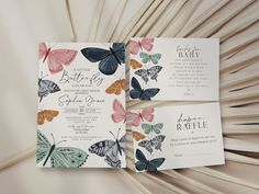 three wedding cards with butterflies on them