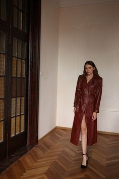 Luxury Long Coat For Fall, Elegant Belted Leather Jacket For Fall, Fall Leather Long Coat With Belt, Belted Leather Long Coat For Fall, Belted Long Leather Jacket For Fall, Luxury Double-breasted Leather Jacket For Spring, Luxury Double-breasted Spring Leather Jacket, Luxury Leather Jacket With Double Button Closure For Fall, Luxury Spring Double-breasted Leather Jacket