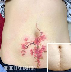 a woman's stomach with pink flowers on it and the bottom part of her belly