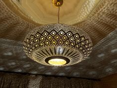 a chandelier hanging from the ceiling in a room