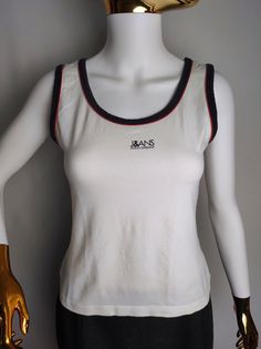 DOLCE & GABBANA vintage women's sleeveless top, made in Italy Good used condition, minor sign of wear Size tagged L, fits like M (please check measurements) Composition: 95% cotton, 5% elastane Measurements: Pit to pit - 15.7" / 40 cm Back length - 20.1" / 51 cm * All measurements are taken with the garment laying flat #5117 90s Summer Vest Tops, 90s Style Summer Vest Top, White Y2k Vest Top, Fitted 90s Crew Neck Tank Top, 90s Style Tank Tops For Summer, Fitted Sleeveless 90s Tops, White Tank Vest In Y2k Style, White Y2k Style Tank Vest, White Y2k Tank Vest