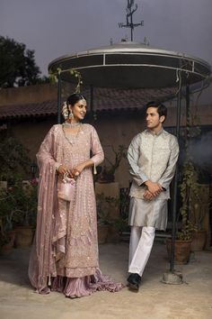 A grey, sophisticated look to pair with the women’s walima suit in our collection. A kurta pajama pairs with a waistcoat for a traditional look. The hand-worked waistcoat features dabka and resham details, featuring shimmering Swarovski stones. The kurta is made of pure karandi while the pajama is made of cotton. 3-Piece Suit, Ready-to-wear, Medium only One-piece only Price is indicative of men’s suit only Click here to see the bride’s suit in our Zar Gul Collection, sold separately. Nehru Jacket With Naqshi For Reception, Straight Kurta, Nehru Jacket With Naqshi For Reception, Nehru Jacket For Eid Reception, Straight Kurta Style, Nehru Jacket For Eid Reception Straight Kurta, Unstitched Salwar Kameez For Reception With Naqshi Detailing, Unstitched Naqshi Salwar Kameez For Reception, Eid Nehru Jacket With Dupatta For Reception, Unstitched Anarkali Suit With Naqshi For Reception, Naqshi Salwar Kameez For Eid Reception