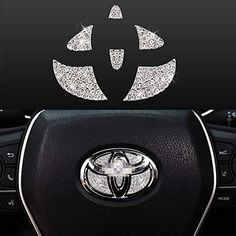 the interior of a car with an emblem on it