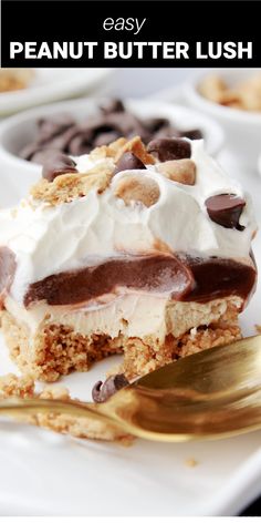 a piece of peanut butter lush dessert on a white plate with a gold fork and spoon