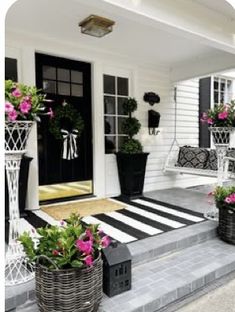 black and white front porch decorated with flowers