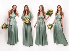 four beautiful women in long dresses holding bouquets and smiling at the camera while standing against a white background