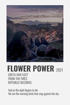 a poster with the words flower power written in black and white, on top of a cityscape