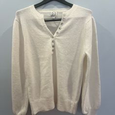 This Beautiful Cream Sweater From Francesca's Is Perfect For Any Junior Or Women's Wardrobe. The Pullover Style Is Accented With Buttons And Comes In A Size Xl, Making It Great For Those Who Prefer A Larger Fit. The Soft Material And White Color Make It A Versatile Piece For Any Occasion. Add This To Your Collection Today! Blue Rain Brand Cozy V-neck Top With Buttons, Winter White Tops With Button Cuffs, White Tops With Button Cuffs For Winter, V-neck Winter Top With Button Cuffs, White Winter Tops With Button Closure, White Tops With Button Closure For Winter, White Buttoned Cozy Top, Cozy White Tops With Buttons, Cozy White Buttoned Top