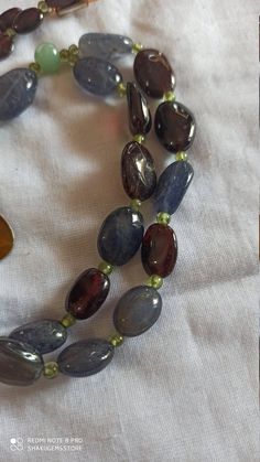 Vintage 340 Carat Fine Quality Natural Iolite, Garnet Multi Gemstone Beads Smooth Oval Shape 30 Inch With Pendent Necklace Stone :Natural Iolite, Garnet Multi Gemstone Shape :- fancy oval Necklace - 30 inch 1 line string Size :- 7x10mm to 12x16mm Weight :- 340 carat Polish :- Handmade Purity :- 100% Natural Gemstone color -brown,red,gray makes a great gift for your loved ones. Click below to see live stock: https://www.etsy.com/au/shop/ShakugemsStore?ref=search_shop_redirect If for any reason yo Natural Oval Beads Gemstones For Jewelry Making, Natural Stone Oval Beads For Jewelry Making, Oval Stones For Jewelry Making, Oval Beaded Necklaces With Natural Stones For Gifts, Spiritual Oval Beaded Necklace With Gemstone Beads, Oval Natural Stone Beads For Gifts, Oval Natural Stones For Jewelry Making, Carnelian Bracelet, Oval Necklace