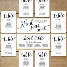 wedding seating cards with the names and numbers for each place card, which are handwritten in black ink