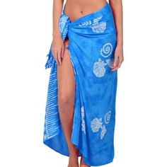 Dress up for a summer luau party in an elegant way with a Blue Sarong! This long blue fabric sarong features white designs of seashells printed on it. You can mix and match this sarong with other tropical-themed attire and accessories to create a unique luau party outfit. Bring the tropical vibes with you wherever you go by wearing this vibrant sarong! Adult Blue Sarong product details:  One size fits most teens and adults Casual Blue Sarong For Vacation, Casual Blue Sarong, Blue Bohemian Sarong For Spring, Blue Sarong For Spring And Summer, Blue Sarong For Spring Vacation, Blue Sarong For Beach, Blue Sleeveless Sarong For Beach, Blue Beachy Sarong For Summer, Beachy Blue Sarong For Summer