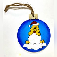 a blue ornament with a yellow bear on it