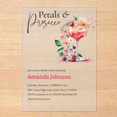 an image of a party card with flowers and drinks in it on a wooden table