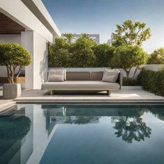 an outdoor living area with a couch and pool