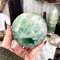 Add a burst of color and clarity to your home or collection with our Fluorite Crystal Ball. This vibrant piece is perfect for enhancing any space with its natural beauty and positive energy. Known for its ability to cleanse and stabilize the aura, fluorite promotes mental clarity and focus. Ideal for meditation, energy work, or as a striking decor item, this crystal ball is a must-have for crystal enthusiasts and collectors. Natural Fluorite: High-quality, ethically sourced. Healing Properties: Green Crystals For Healing, Green Natural Stones Crystals For Healing, Green Spiritual Healing Crystals, Pisces Jewelry, Crystal Spiritual, Green Fluorite Crystal, Sphere Crystal, Gazing Ball, Green Fluorite