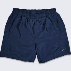 Nike Dark Navy Blue Swimming Shorts  Elastic Waist , Adjustable Has Pockets  Swoosh Logo Mesh Lining Above the Knee Cut In Decent Vintage Condition No Stains Small Hole on the Back - Shown in Pictures Size Men's Large PLEASE CHECK THE MEASUREMENTS Measurements: Waist: 32 in Total Length: 17.5 in Inseam: 6.5 in FREE AND FAST SHIPPING IN THE USA Cheap Men's Denim Blue Shorts, Nike Bleu, Swimming Shorts Men, Nike Outfits Men, Blue Shorts Men, Swimming Shorts, Cool Outfits For Men, Swoosh Logo, Streetwear Y2k