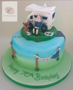 a birthday cake with a camper and dog on it's top tiers