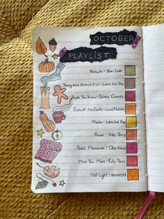 the october playlist is open on top of a yellow blanket with writing in it