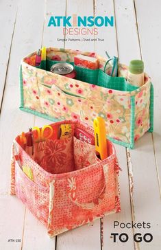 two storage bags sitting on top of a white table next to each other with pens and pencils in them