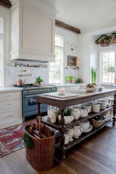 a large kitchen island with lots of dishes on it