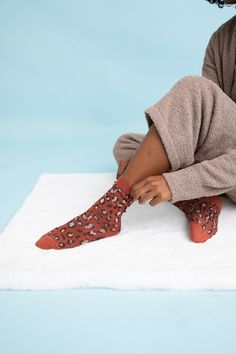 **This product is shipped by a third party warehouse within the US and may arrive separately from your complete order. introducing our Leopard Knit Socks! These cozy and comfy socks are perfect for lounging around the house or adding a touch of fun to your everyday outfit. The leopard print is unique and eye-catching, sure to add a touch of personality to any outfit. The soft, stretchy fabric is comfortable and will keep your feet warm all day long. Whether you're looking for a gift for a animal Cozy Socks For Stocking Stuffer, Comfortable Cozy Socks For Stocking Stuffers, Cozy One Size Socks For Stocking Stuffer, Comfortable One Size Socks For Stocking Stuffers, Snug Fit Socks For Fall Loungewear, Cozy Soft Brown Socks, Casual Indoor Socks, Super Soft Socks For Fall Loungewear, Casual Soft Knit Socks For Stocking Stuffers