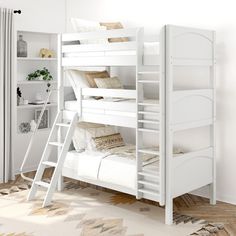 a white bunk bed sitting in a bedroom next to a window