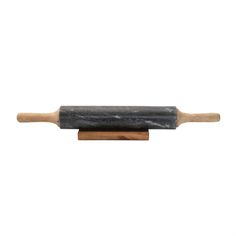 a black and white marble rolling pin with wooden handle