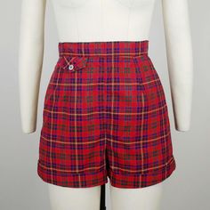 Rare early 1950s Jantzen European fabric plaid cotton shorts ~Red, green, blue, and yellow plaid cotton ~Front button flap lipstick pocket ~Back metal zipper  Hand washed and ready to wear. Condition: Excellent. Wear spot at crotch, faint whitish spot on back and part of zipper has been restitched Size: Marked 10. Fit like a modern XS *please consult measurements to ensure fit Measurements Waist: 25"(top of waistband) / 24.5" (bottom of waistband) Hip: 34.5-35" Rise: 13" Inseam: 2.25" Outseam: 14" Message us with any questions! Sarah Vogt Plaid Cotton Shorts For Daywear, Preppy Fitted Cotton Shorts, Preppy Fitted Short-length Shorts, Preppy Fitted Shorts With Short Length, Fitted Plaid Shorts, Vintage Fitted Shorts, Vintage Fitted Shorts With Short Legs, Vintage Fitted Shorts With Short Inseam, Fitted Plaid High-waisted Shorts