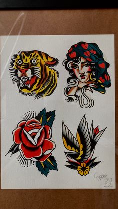 an image of some tattoos on display in a glass case with the reflection of another tattoo artist's face