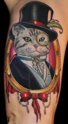 a cat with a top hat and eyeglasses on it's leg is shown