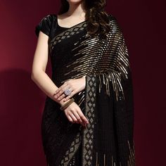 Black & Golden colored saree is made from georgette fabric which is highlighted with beautiful sequins embroidered work as shown. comes along unstitched banglori satin blouse which you can customise as per your design/style. Occasion - You can wear this saree for party and functions. Note:- The actual product may differ slightly in color and design from the one illustrated in the images when compared with computer or mobile screen. Measurements: Saree : Georgette : 5.5 Mtrs Blouse : Georgette : Black Pre-draped Saree With Sequins, Party Pre-draped Saree With Mirror Work In Art Silk, Party Pre-draped Chinon Saree With Mirror Work, Festive Black Pre-draped Saree With Self Design, Traditional Georgette Pre-draped Saree With Sequins, Semi-stitched Georgette Saree With Self Design, Semi-stitched Self Design Georgette Saree, Black Sequined Pre-draped Saree, Celebration Georgette Blouse Piece With Sequins