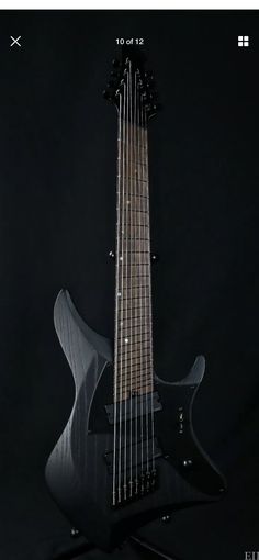 an electric guitar sitting on top of a black background with the caption's name below it