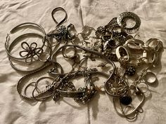 This is a 1/2 pound lot of broken and not, vintage and newer craft jewelry. The majority of these are wearable or for crafts, Silver tones There are necklaces, earrings, bracelets, key rings, broken pieces etc etc. Both vintage and modern. Perfect for your slow stitches or scrapbooking projects. Or other works of art This is NOT a mystery bag or box, so there will be no surprises You get everything in the picture. So study the pictures carefully Various materials such as plastic, metal, beads, etc etc Silver Metal Jewelry For Accessorizing, Silver Metal Jewelry, Costume Jewelry For Accessorizing, Silver Charms Jewelry For Accessorizing, Silver Charms Jewelry, Metal Charms Jewelry For Crafting, Vintage Charms For Crafting Jewelry, Vintage Silver Jewelry With Unique Variations, Handmade Silver Jewelry For Collecting