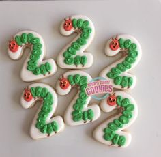 decorated cookies in the shape of numbers with ladybugs on them