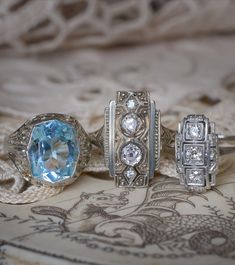 The icy aesthetic of 1920s Art Deco Jewellery! Glittering old-cut diamonds and arctic-blue aquamarine, set in white gold for maximum scintillating effect - early Art Deco jewellery loved a cold colour palette. For these & other Art Deco stunners, shop Antique & Vintage Elegance, online jewellery. #ArtDecoJewellery #ArtDecoRings #Aquamarine #CocktailRing #1920s #ArtDeco Icy Aesthetic, Arctic Blue, 1920s Art, 1920s Art Deco