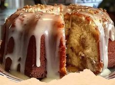 a bundt cake with white icing on a plate