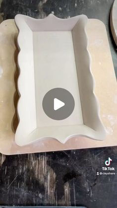 a video demonstrating how to make an oval tray with scalloped edges for serving food