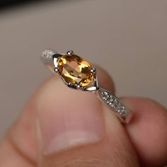 This is a gorgeous handmade creation. Its beauty is its simplicity & Elegance. The 5*7 mm oval shape faceted natural citrine is crafted in solid sterling silver and with rhodium plated. All item is sent in a beautiful gift box If you have any idea of design your ring,pls contact me directly. You can realize more lovely stuff clicking the link https://www.etsy.com/shop/knightjewelry?refshopsection_shophome_leftnav Please leave the correct address and you phone number for delivering successful Oval Citrine Birthstone Ring, Oval Yellow Citrine Birthstone Ring, Oval Topaz Ring With Citrine Accents, Yellow Oval Topaz Ring With Polished Finish, Oval Yellow Topaz Ring With Polished Finish, Oval Citrine Birthstone Ring With Accent Stones, Yellow Oval Birthstone Promise Ring, Elegant Yellow Oval Birthstone Ring, Yellow Oval Crystal Ring With Gemstone