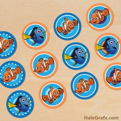 the finding nemo cupcakes are decorated with blue and orange polka dot circles