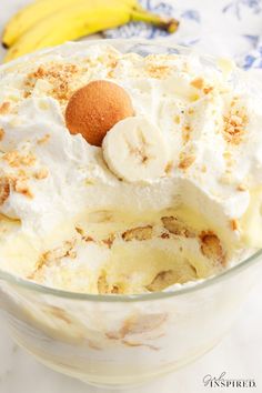 a banana pudding in a glass bowl on a table