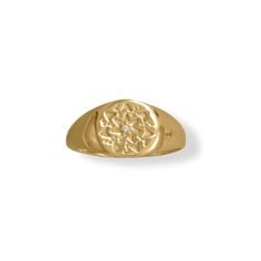 a gold signet ring with a diamond in the center