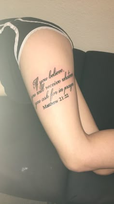 a woman with a tattoo on her arm that says, if you believe to be alive