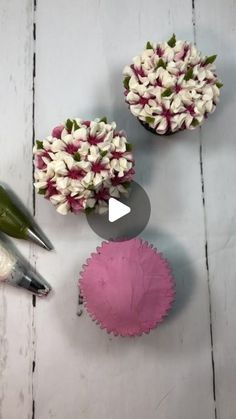 flowers are arranged in vases on a white wooden table with scissors and other tools