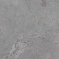 a white marble textured background or wallpaper with grey veiners and scratches on the edges