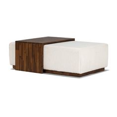 a wooden and white ottoman sitting on top of a floor