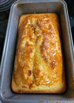 a loaf of bread sitting on top of a metal pan