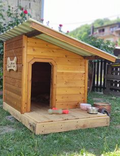 a dog house made out of wooden boards